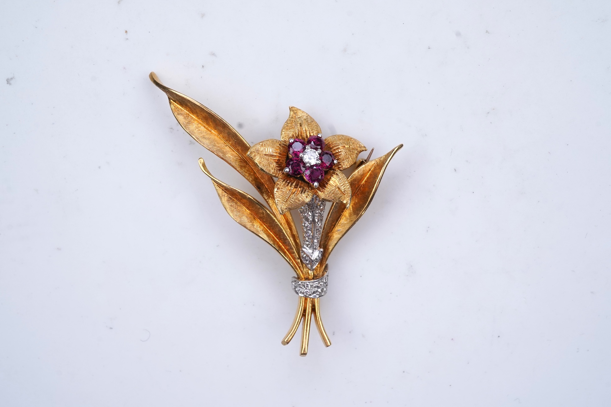 A gold, ruby and diamond brooch, circa 1966